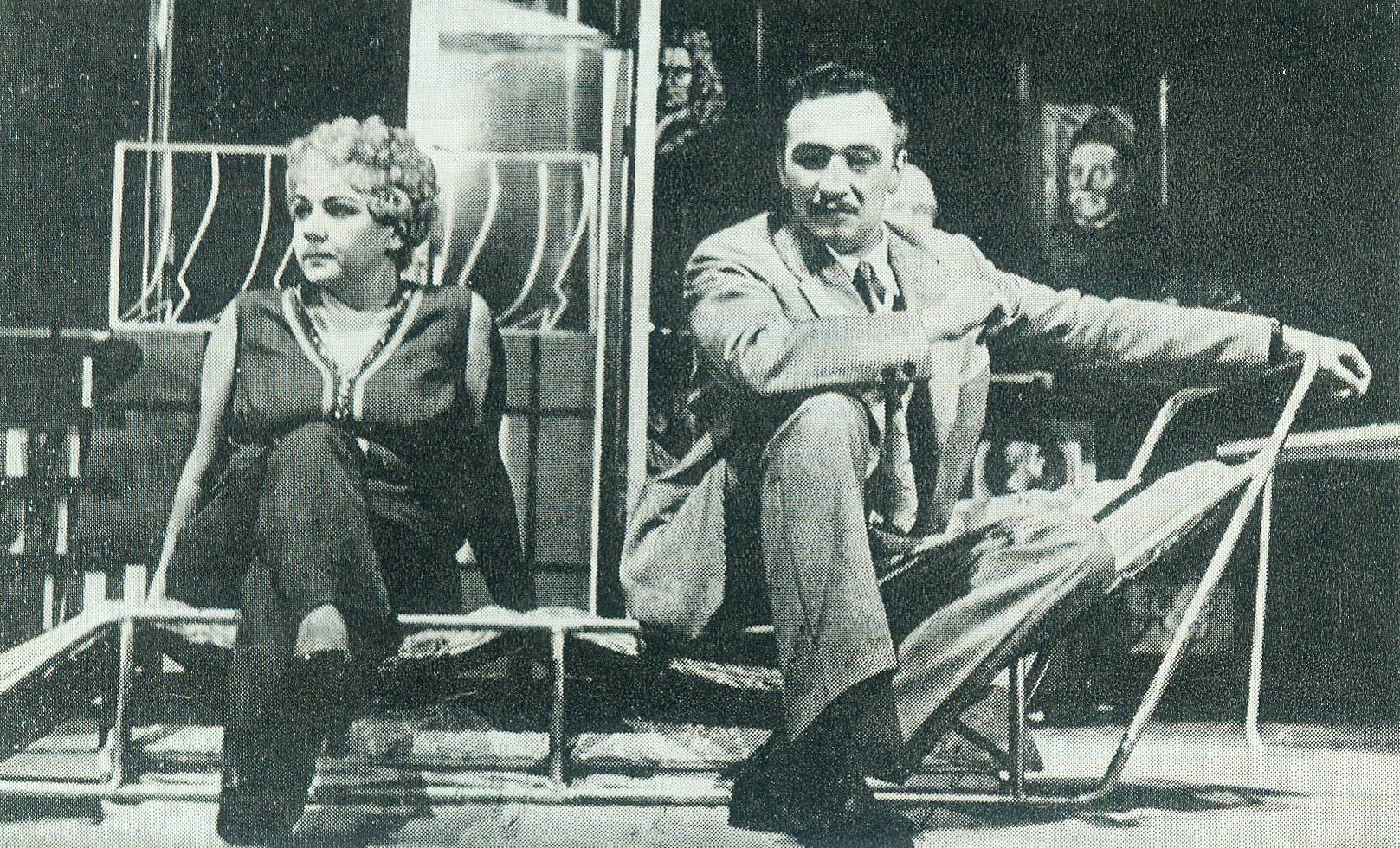 Народная артистка БССР Г.П. Маркина в роли Матери, заслуженный артист БССР Н.П. Тишечкин в роли Отца в трагикомедии А. Макаенка "Затюканный апостол". Источник иллюстрации: Белорусский Академический театр имени Якуба Коласа : главный режиссер ― лауреат премии Ленинского комсомола В. Е. Мазынский / Белорусский государственный Академический драматический театр им. Я. Коласа ; [фото С. Е. Кохана]. – Минск, 1981. – С. 10.